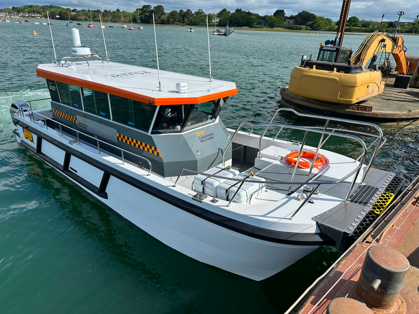 CRC Hunter commercial catamaran workboat alongside a marine construction barge