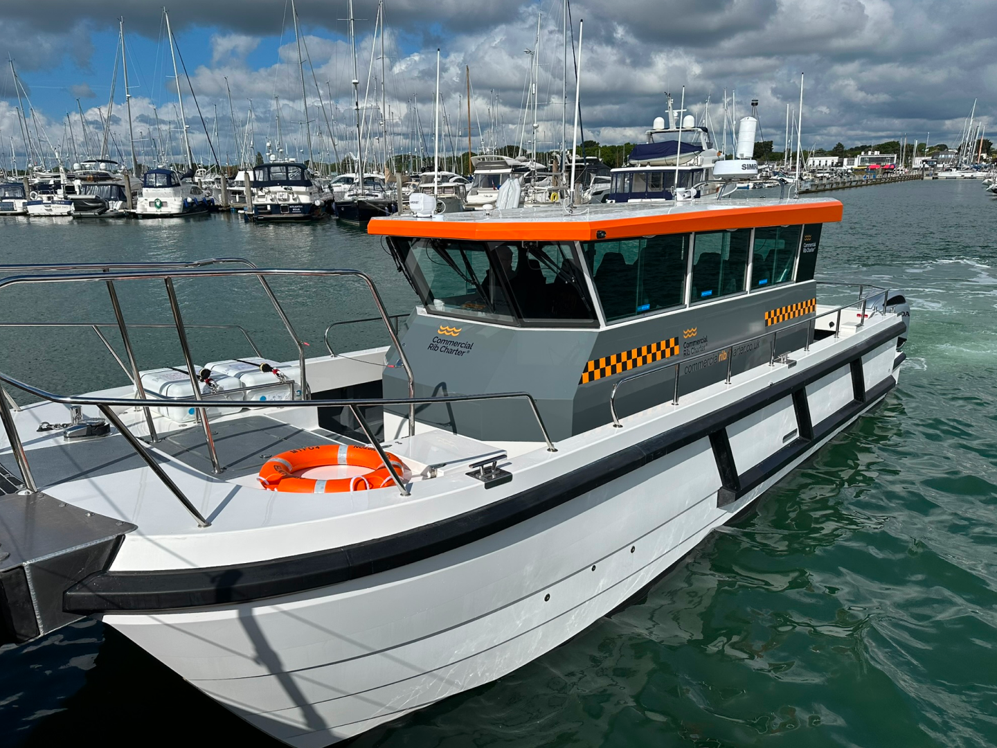 Close-up of CRC Hunter commercial catamaran workboat in a marina